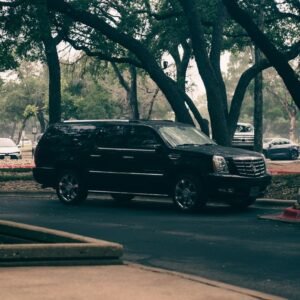 Escalade IQ vs IQL: Is Extra Length Worth $3K in 2026?