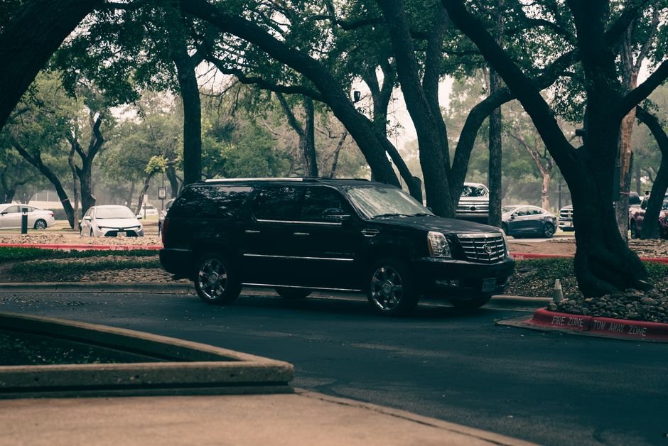 Escalade IQ vs IQL: Is Extra Length Worth $3K in 2026?
